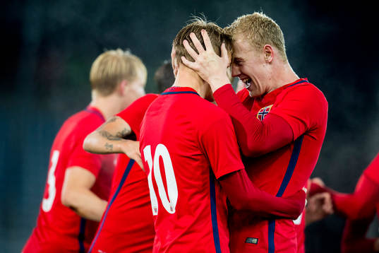 Martin Ødegaard of Norway celebrates with Henrik Bjørdal