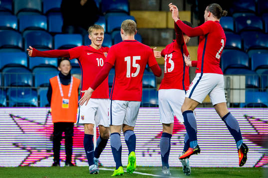 Martin Ødegaard of Norway celebrates with teammates