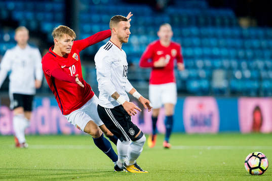 Martin Ødegaard of Norway and Marcel Hartel of Germany