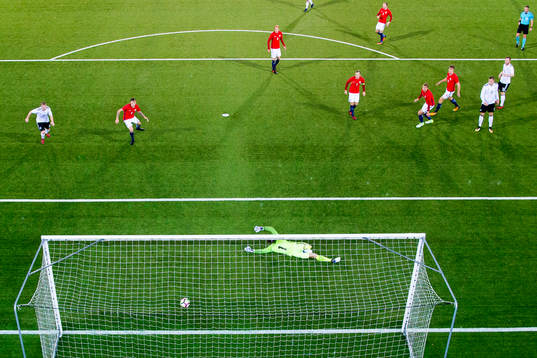Cedric Teuchert of Germany scores 0-1 behind goalkeeper