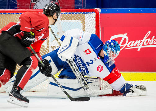 Robin Alvarez of Malmö Redhawks and Goalkeeper Lukas