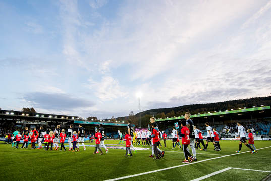 Players enter the field