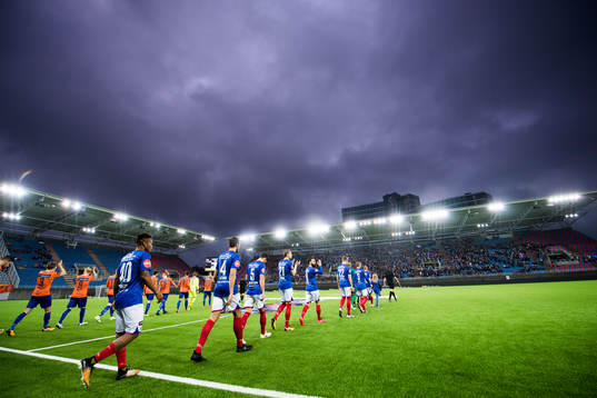 Players enter the pitch of Intility Arena
