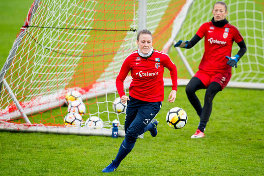 Isabell Herlovsen and goalkeeper Cecilie Fiskerstrand of
