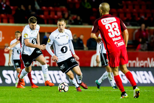 Nicklas Bendtner and Milan Jevtovic of Rosenborg and Amin
