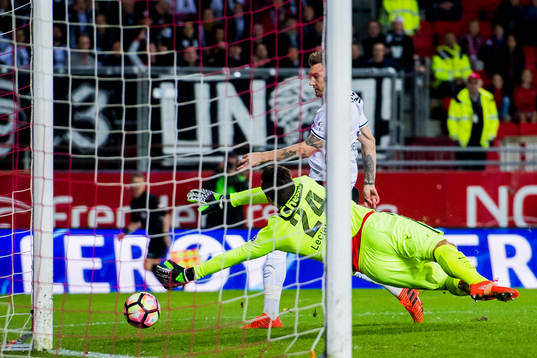 Nicklas Bendtner of Rosenborg scores 1-0 behind Goalkeeper