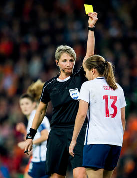 Referee Jana Adamkova of the Czech Republic hands out a