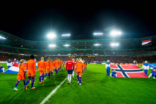 The teams enter the pitch
