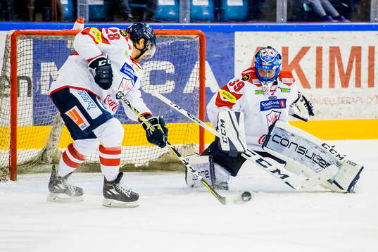 Stephan Joseph Vigier and goaltender Nils Erik Christoffer