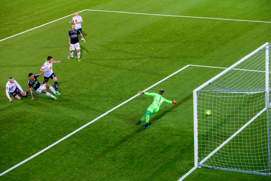 Bassel Jradi of Strømsgodset scores 2-1 behind goalkeeper