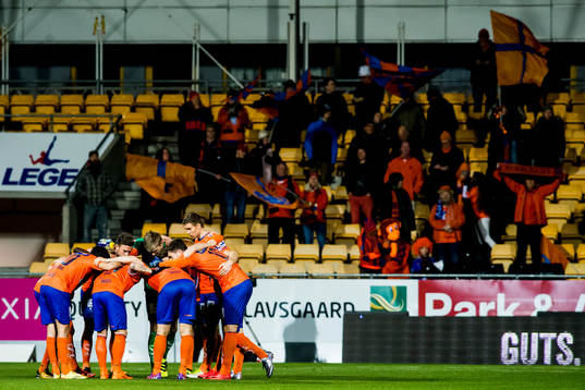 The Aalesund players gather in a ring