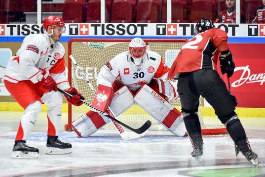Lars Bryggman of Malmö Redhawks and Lukas Krajicek and