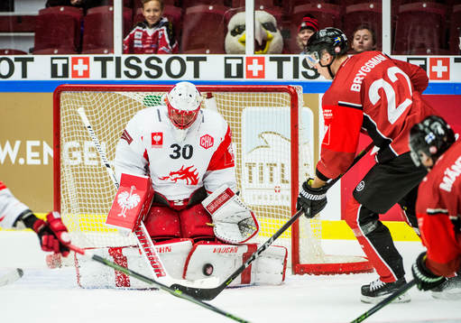 Lars Bryggman of Malmö Redhawks and goalkeeper Simon