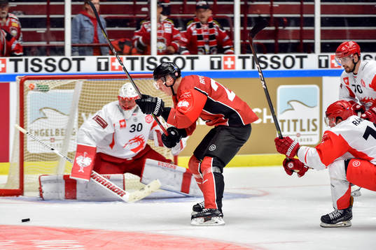 Lars Bryggman of Malmö Redhawks and goalkeeper Simon