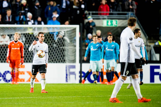 Mike Jensen of Rosenborg looks dejected while Zenit