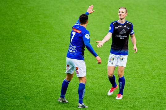 Simon Andreas Larsen of Start celebrates with teammate