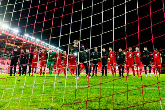 Players of Brann celebrate their win