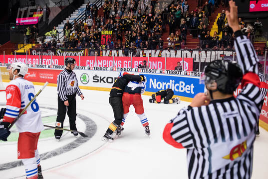 Lukas Kilström of Brynäs fights Thomas Larkin of Adler