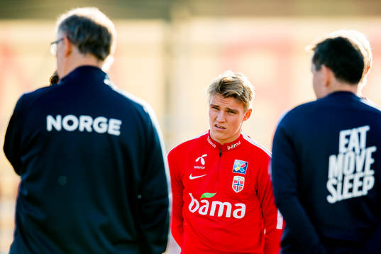 Martin Ødegaard of Norway looks toward Lars Lagerbäck,