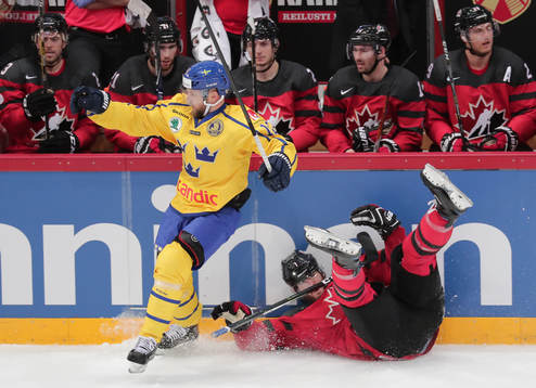 Fredrik Pettersson #12, Sweden and Simon Despres #7, Canada