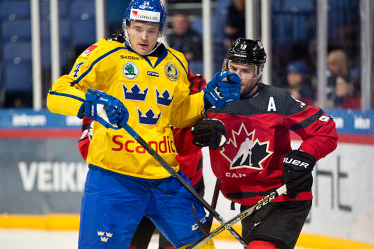 Marcus Högström #14, Sweden and Gilbert Brule #19, Canada