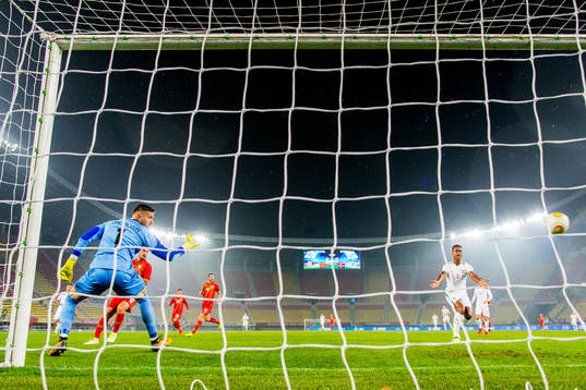Goalkeeper Stole Dimitrevski of Macedonia and Ola Kamara of