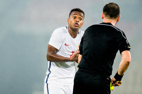 Ola Kamara of Norway receives a yellow card