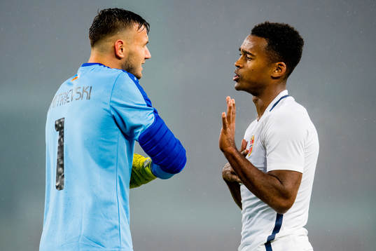 Goalkeeper Stole Dimitrevski of Macedonia and Ola Kamara of