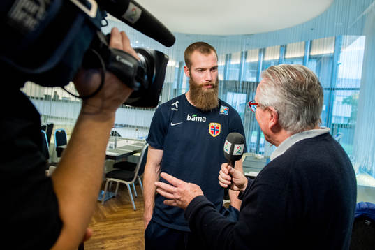 Jo Inge Berget of Norway talks to journalist Davy Wathne of