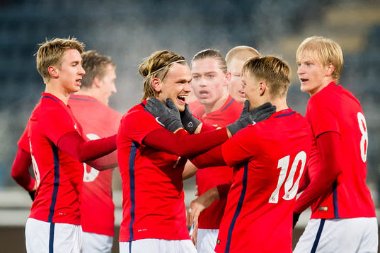 Iver Fossum of Norway celebrates with his teammates