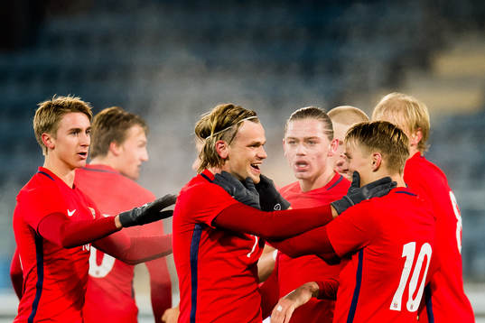 Iver Fossum of Norway celebrates with his teammates