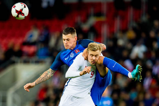 Martin Skrtel of Slovakia and Alexander Toft Søderlund of