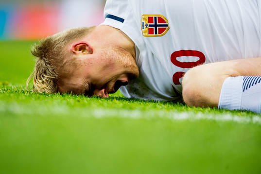 Mats Møller Dæhli of Norway lies down injured