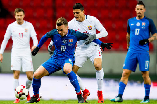 Albert Rusnak of Slovakia and Mohamed Elyounoussi of Norway