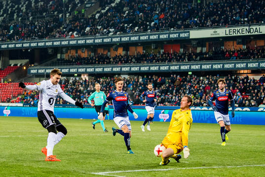 Nicklas Bendtner of Rosenborg sees his shot saved by