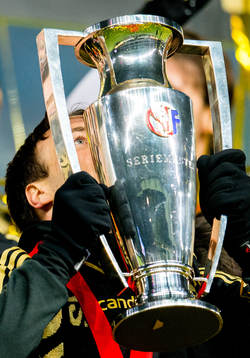 Mike Jensen of Rosenborg kisses the league trophy