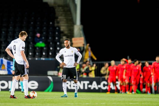 Nicklas Bendtner and Samuel Adegbenro of Rosenborg look