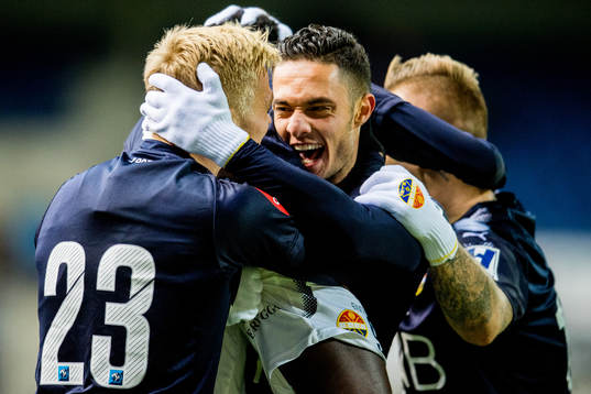 Tokmac Nguen of Strømsgodset (partly hidden) celebrates