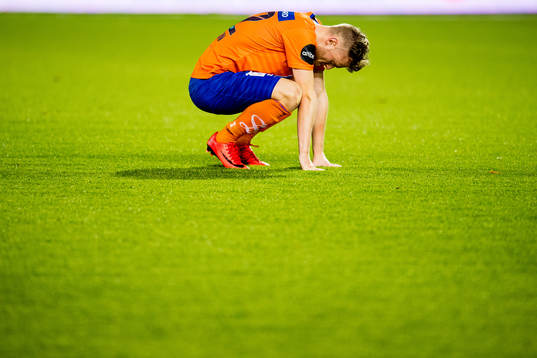 Adam Ørn Arnarson of Aalesund looks dejected being
