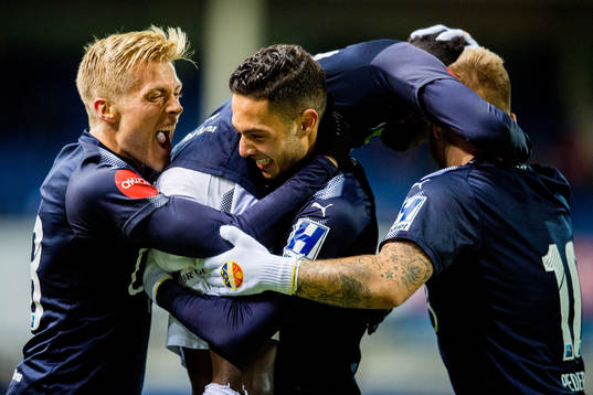 Tokmac Nguen of Strømsgodset celebrates with teammates