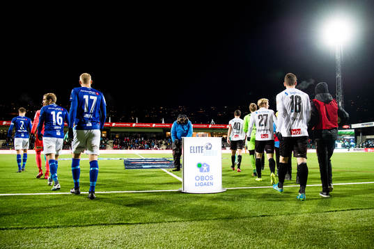 The players enter the field
