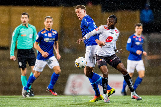 Michael Karlsen of Ranheim and Gilbert Koomson of Sogndal