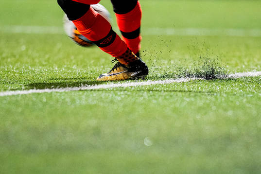 A goalkeeper kicks the ball