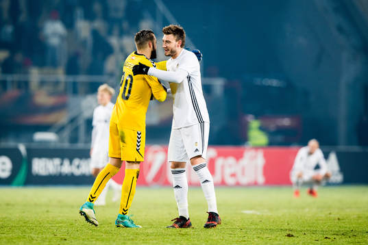 Goalkeeper Filip Gacevski of FK Vardar and Nicklas Bendtner
