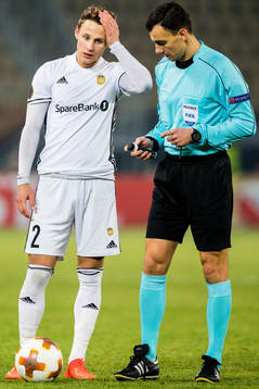 Vegar Eggen Hedenstad of Rosenborg and Serhiy Boiko, referee