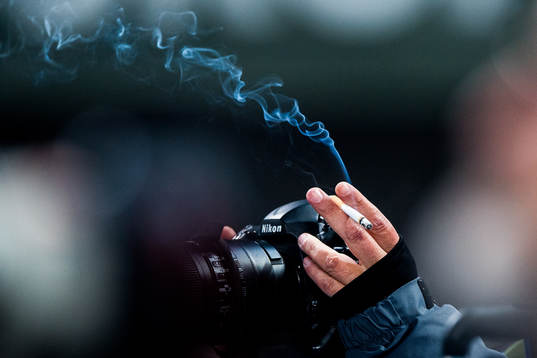 A photographer with a cigarette