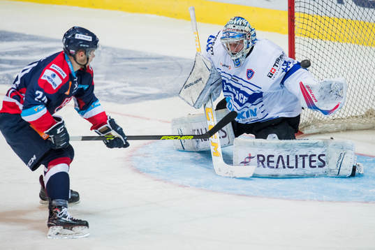 Matus Sukel of Slovakia and Goaltender Florian Hardy of