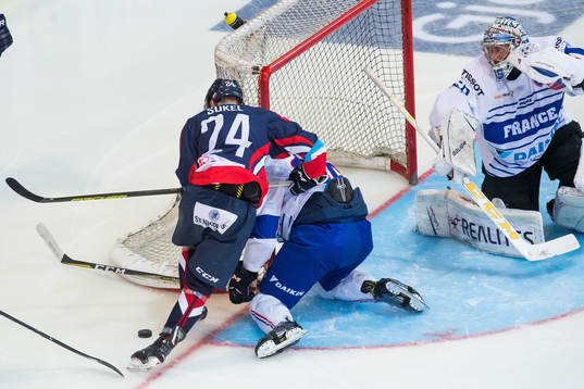 Matus Sukel of Slovakia and Goaltender Florian Hardy  of