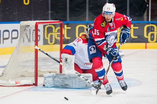 Goaltender Aleksandr Sharychenkov of Russia and Tommy
