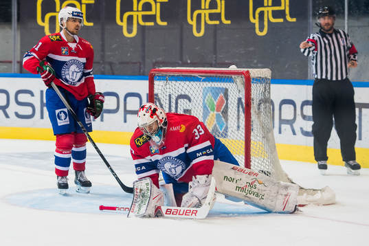 Mats Rosseli Olsen and goaltender Henrik Haukeland of